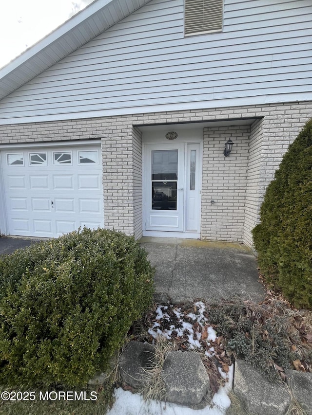 view of exterior entry featuring a garage