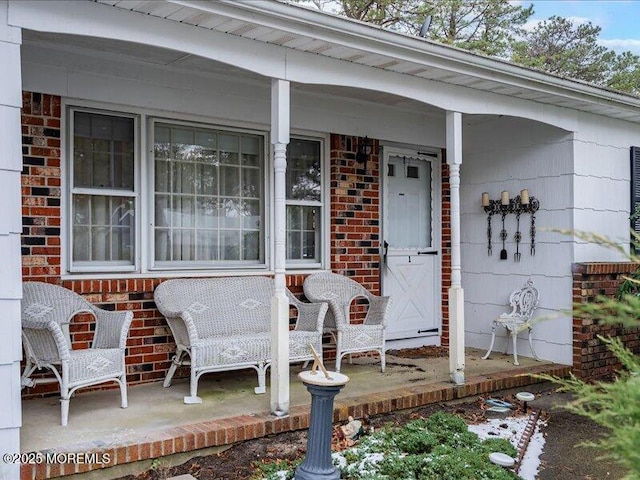 entrance to property featuring a porch