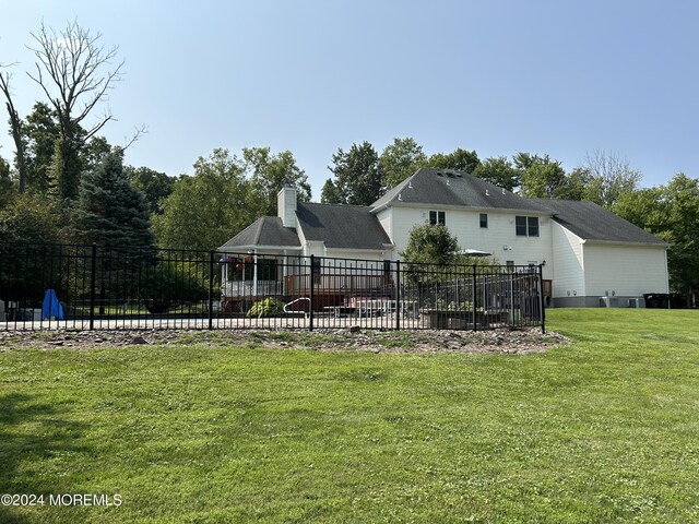 back of house with a yard