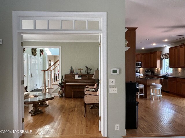 interior space with light wood-type flooring and sink