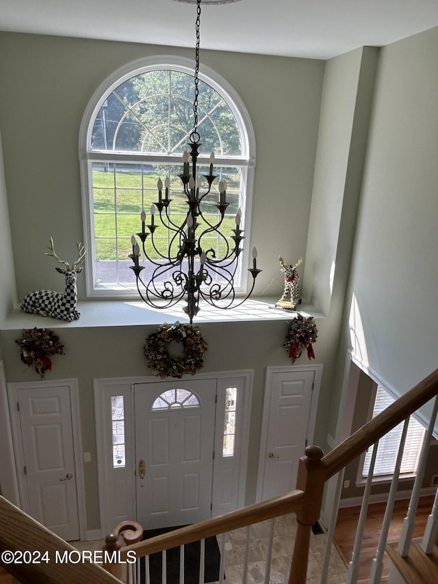 entrance foyer featuring a chandelier