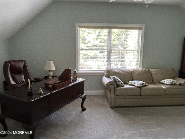 home office featuring carpet flooring, ceiling fan, and lofted ceiling