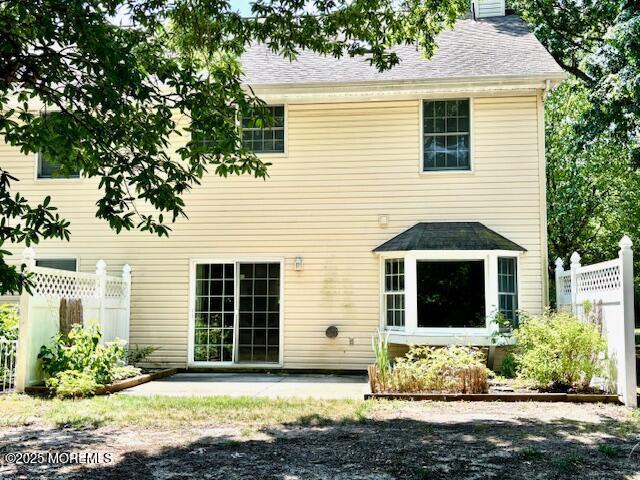 rear view of house featuring a patio