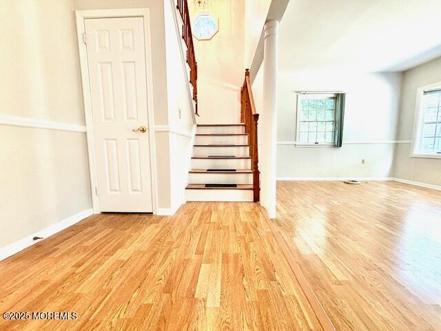 stairs featuring hardwood / wood-style flooring