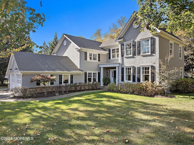 view of front facade featuring a garage and a front lawn