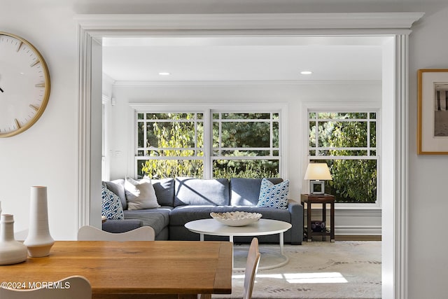 living room featuring crown molding