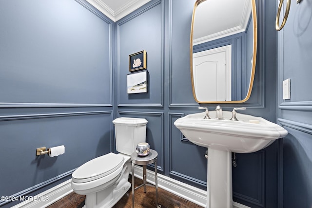 bathroom featuring toilet and ornamental molding