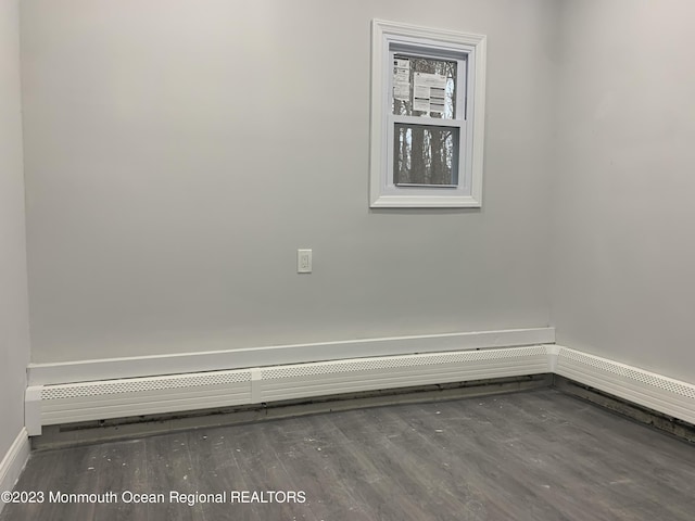 empty room with hardwood / wood-style flooring