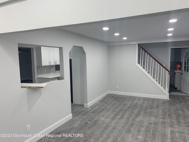 unfurnished living room featuring hardwood / wood-style floors