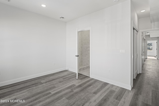 empty room with dark wood-type flooring