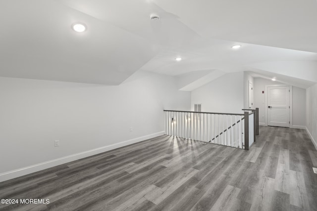 bonus room featuring vaulted ceiling and hardwood / wood-style flooring