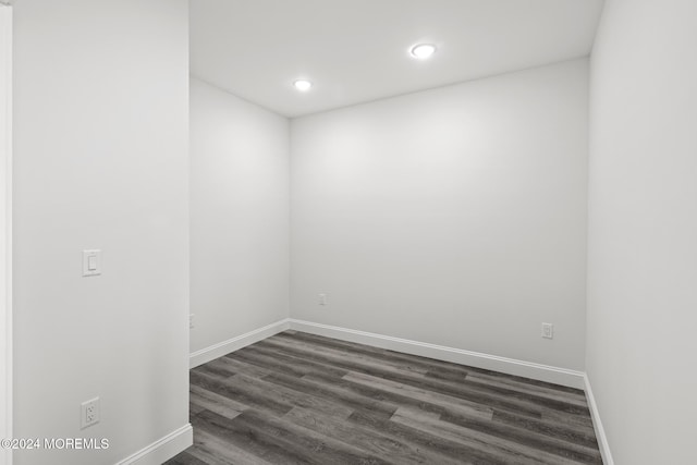 spare room featuring dark hardwood / wood-style floors