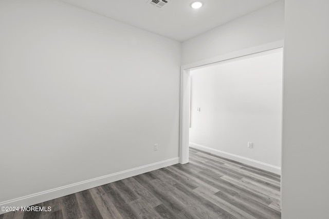 empty room with hardwood / wood-style floors