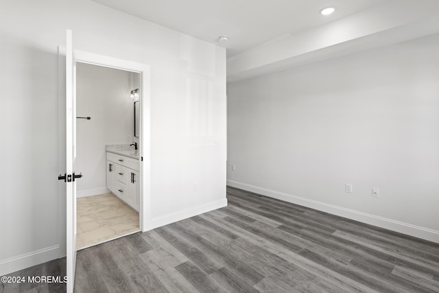 unfurnished room featuring hardwood / wood-style flooring