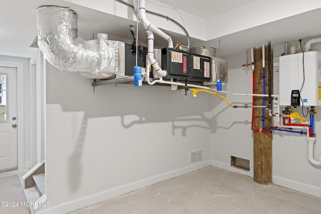 utility room with water heater