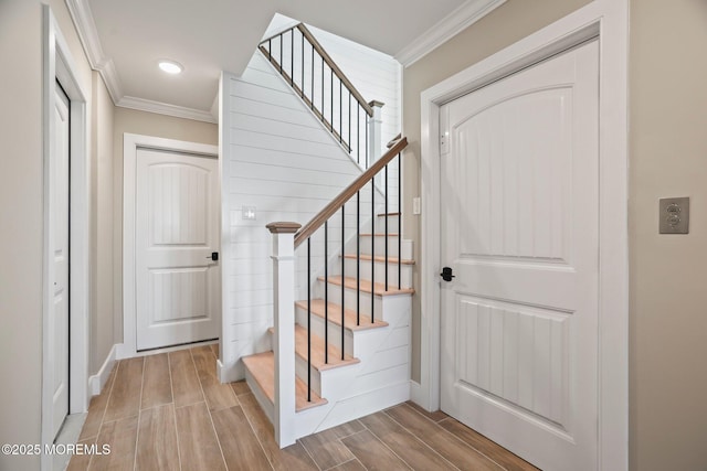 staircase with ornamental molding