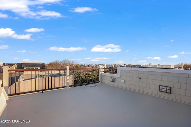 view of patio featuring a balcony