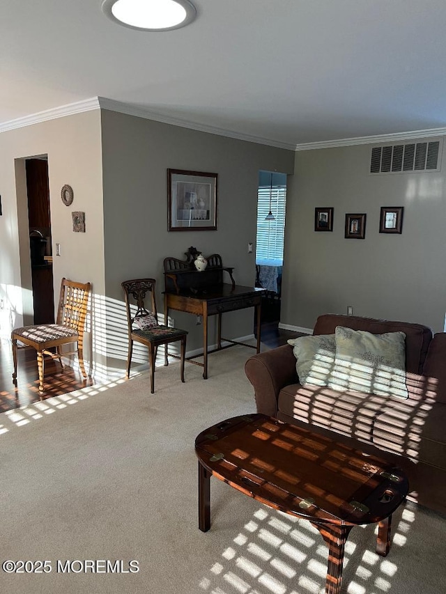 living room with crown molding and carpet