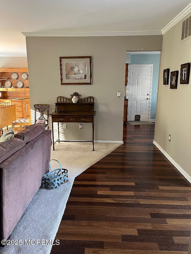 living room featuring dark hardwood / wood-style floors and ornamental molding