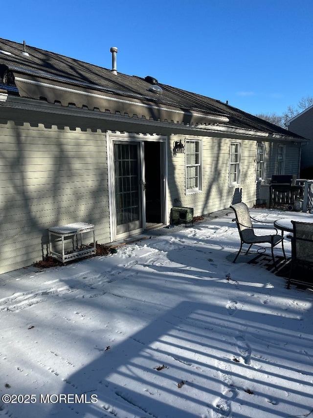 view of snow covered property