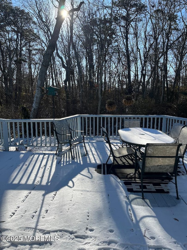 view of snow covered deck