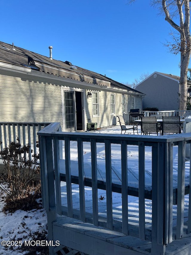 view of snow covered deck