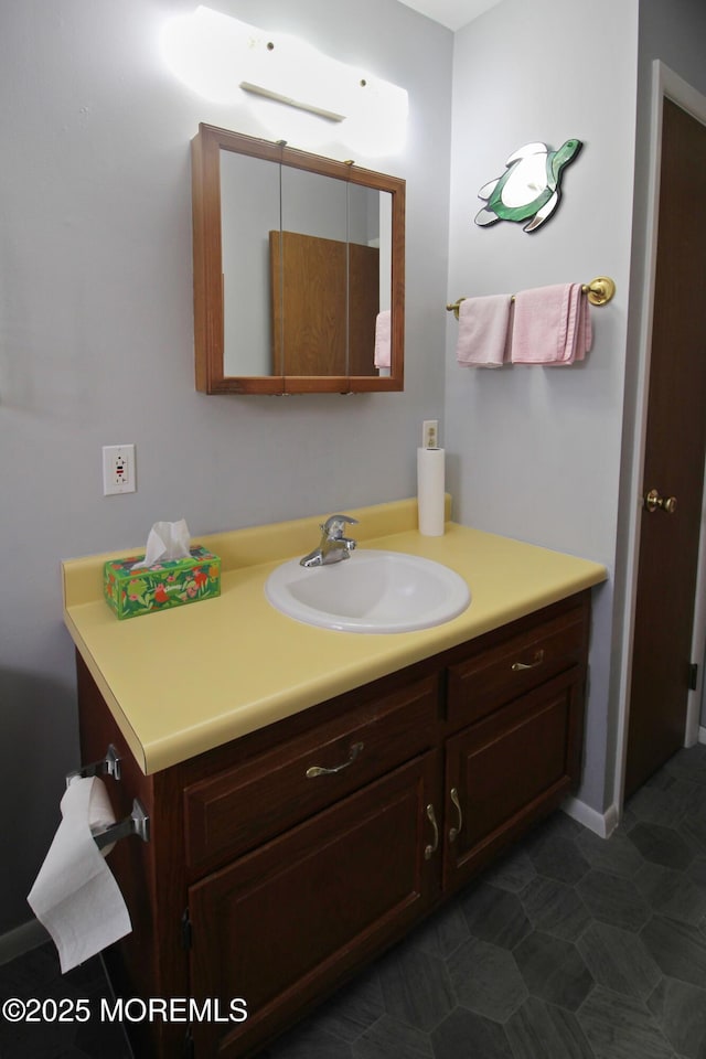 bathroom with tile patterned flooring and vanity