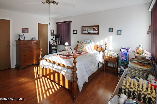 bedroom with ceiling fan and dark wood-type flooring