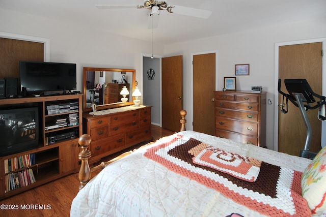 bedroom featuring dark hardwood / wood-style floors and ceiling fan