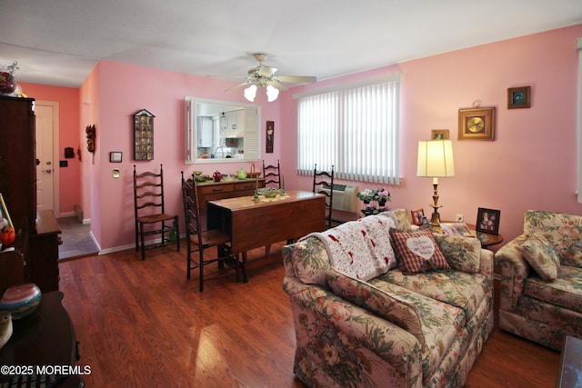 living room with dark hardwood / wood-style floors and ceiling fan