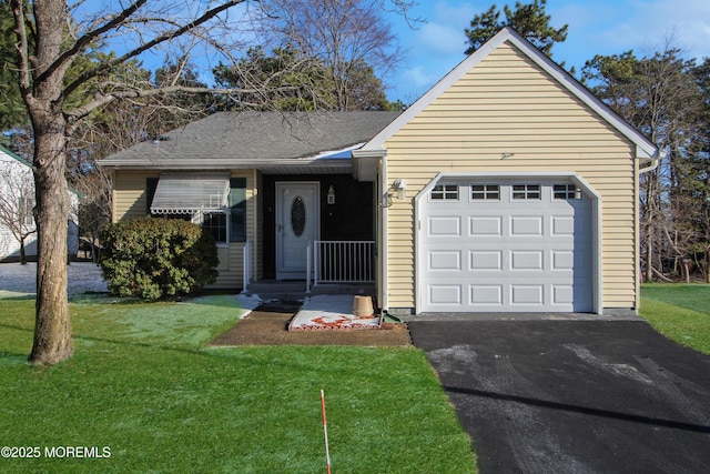 ranch-style house with a garage and a front yard