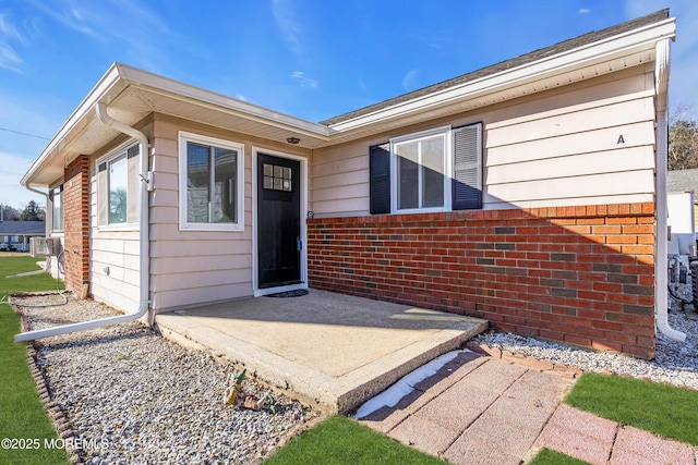 property entrance with a patio area