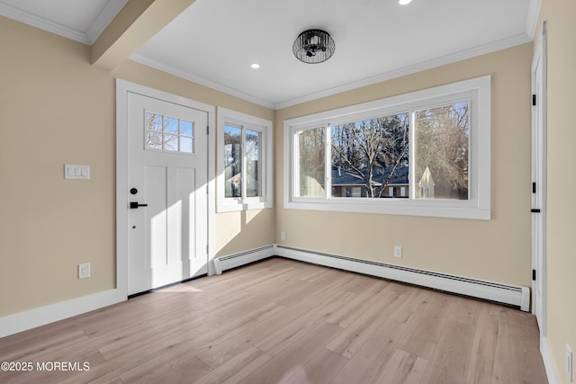 foyer featuring light hardwood / wood-style floors, ornamental molding, and a baseboard radiator