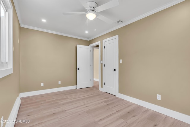 unfurnished bedroom with ceiling fan, light wood-type flooring, and crown molding