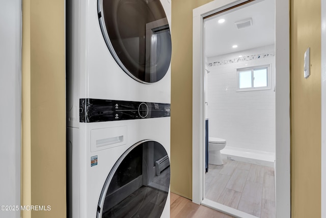 washroom with stacked washer / drying machine