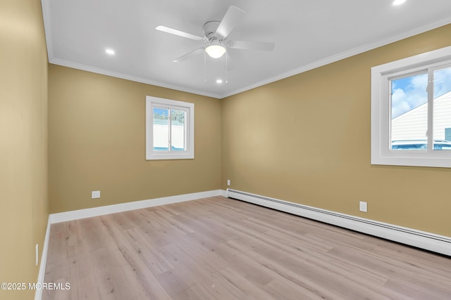 unfurnished room featuring baseboard heating, ceiling fan, light hardwood / wood-style floors, and crown molding