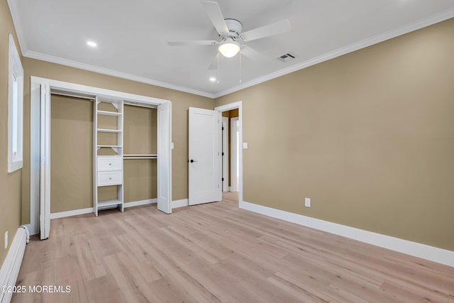 unfurnished bedroom with baseboard heating, a closet, light wood-type flooring, ceiling fan, and ornamental molding