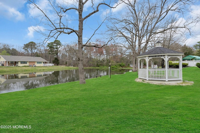 view of yard with a water view and a gazebo