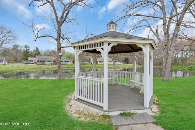 exterior space featuring a yard, a water view, and a gazebo