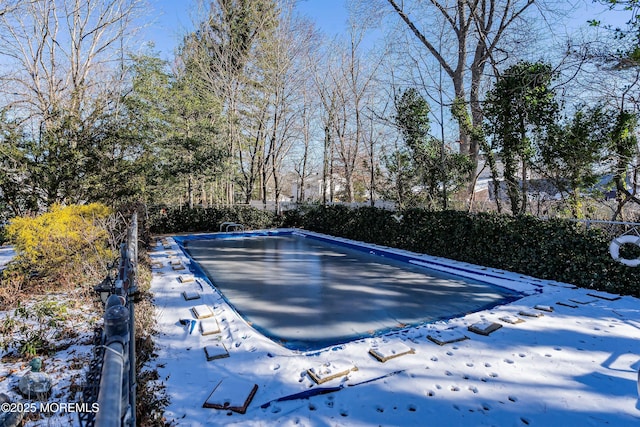 view of snow covered pool