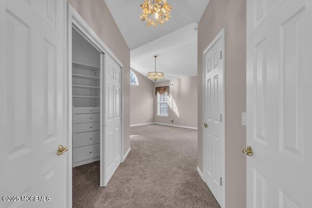 hall featuring light colored carpet