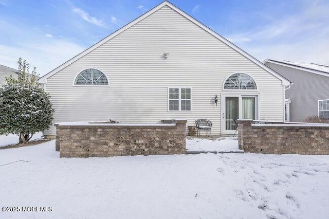 view of snow covered house