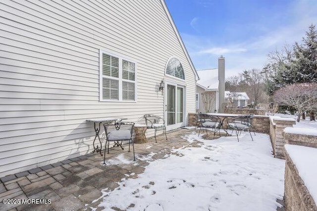 view of snow covered patio