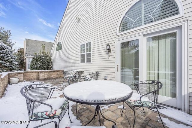 view of snow covered patio