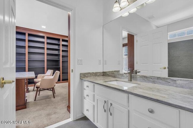 bathroom featuring vanity and an inviting chandelier