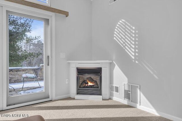 unfurnished living room featuring carpet