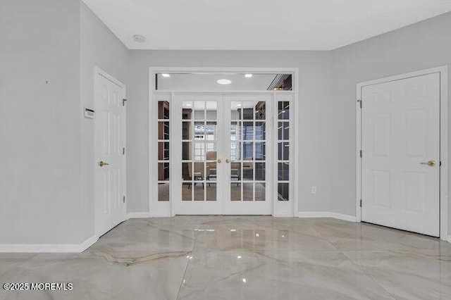 unfurnished room with french doors