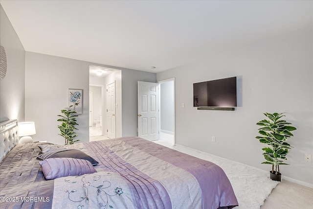 carpeted bedroom with ensuite bathroom