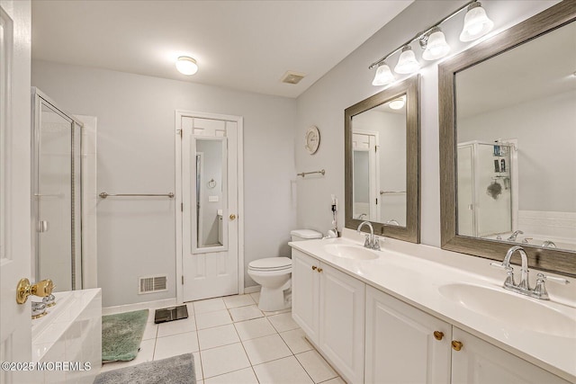 full bathroom with tile patterned flooring, vanity, independent shower and bath, and toilet