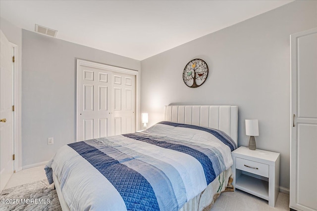 carpeted bedroom featuring a closet